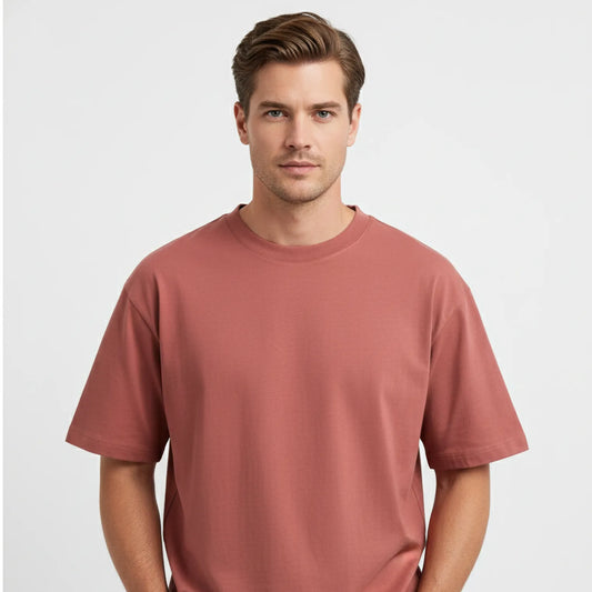 Man wearing a red-brown t-shirt on a white background