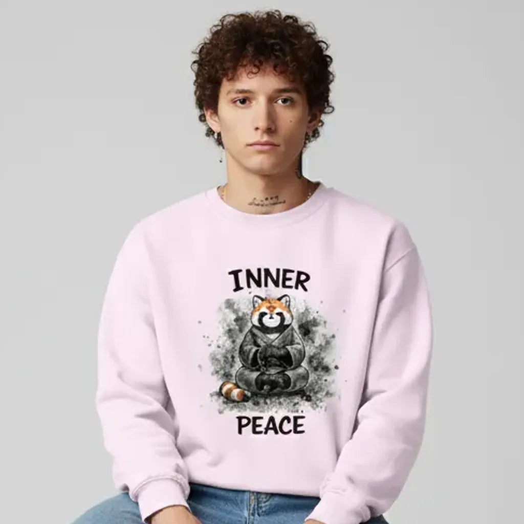Person wearing a pink sweatshirt with a bear graphic and 'Inner Peace' text on a gray background